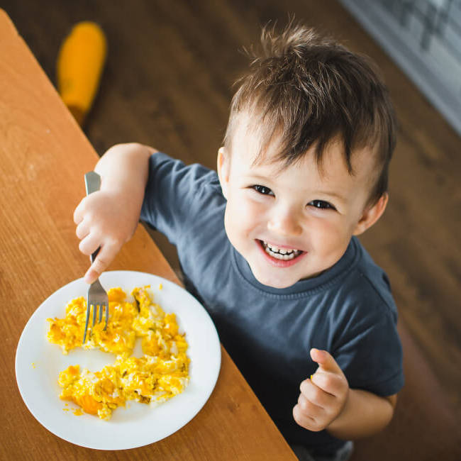 happy-child-eating-breakfast